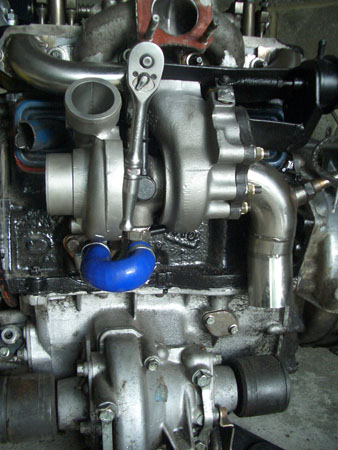 Showing Custom manifold bolted into place everything fitting snug